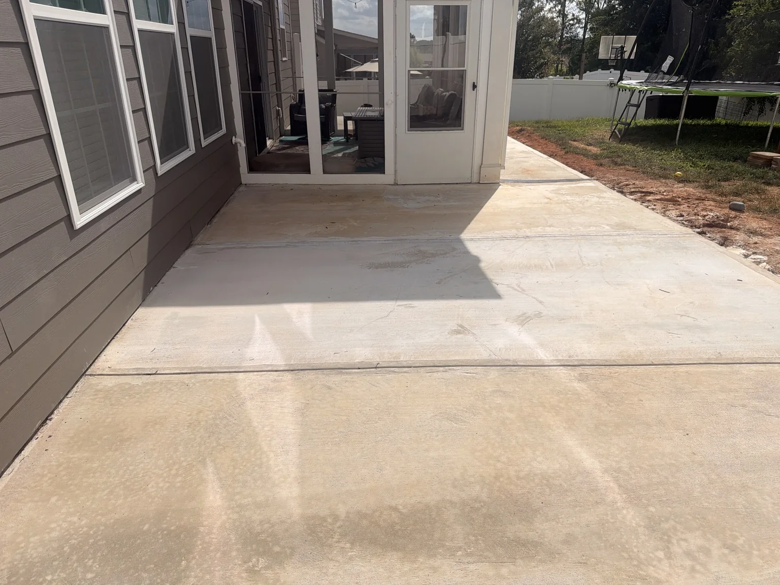 Concrete patio connected to the porch