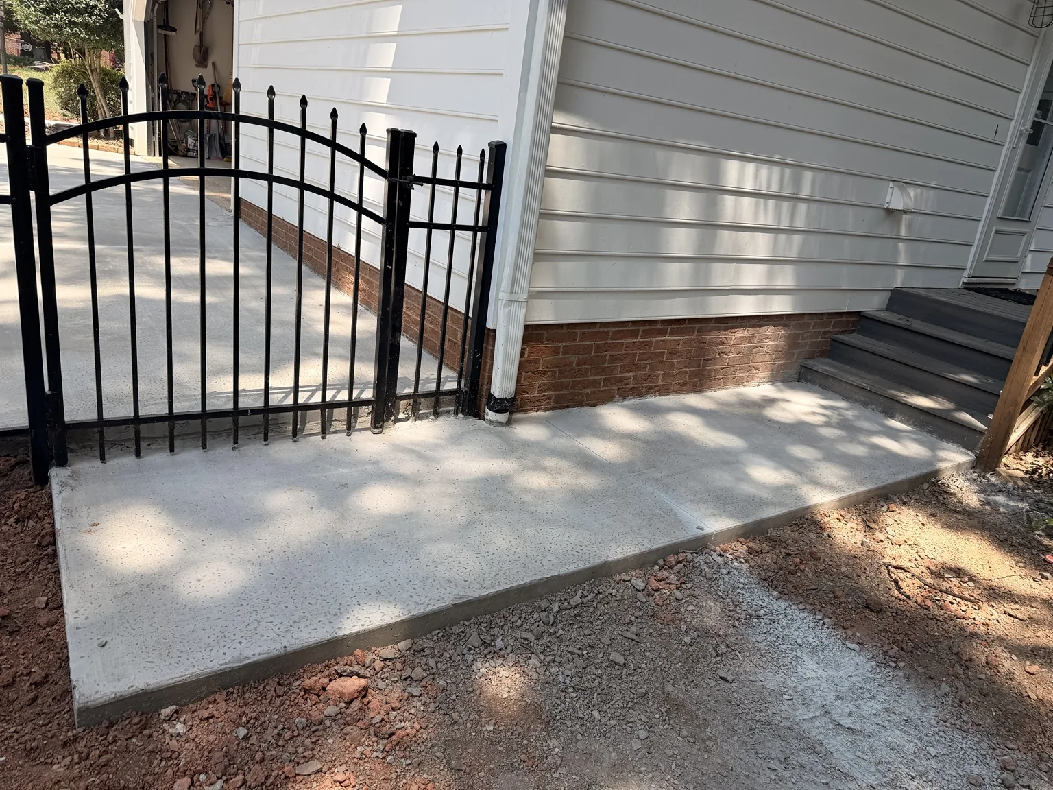 Concrete entry by the porch