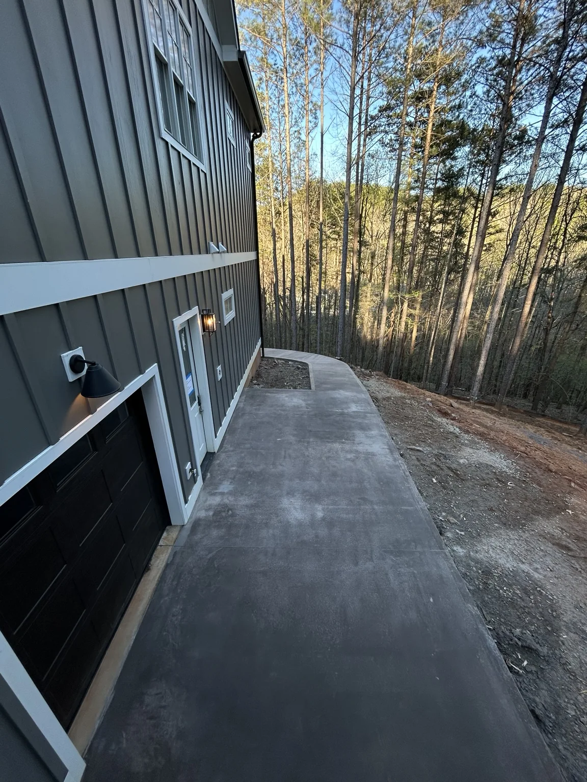 Concrete walkway beside the home