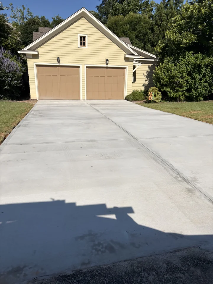 Completed concrete approach in front of a detached garage