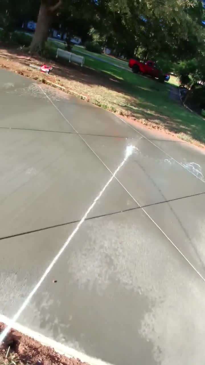 Freshly finished concrete driveway with a clean tool mark detail