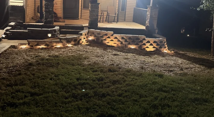 Curved block walls with lighting visible at night